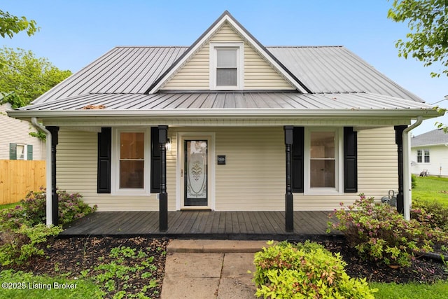 209 W High St, Lebanon, KY 40033 - bungalow-style home with a porch, fence, metal roof, and a standing seam roof