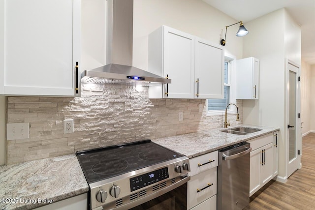 209 W High St, Lebanon, KY 40033 - kitchen with white cabinetry, wall chimney range hood, appliances with stainless steel finishes, and a sink