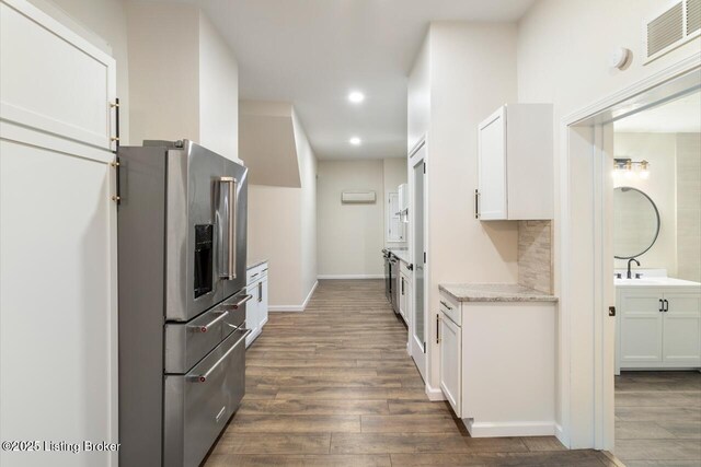 209 W High St, Lebanon, KY 40033 - kitchen featuring visible vents, recessed lighting, dark wood-style flooring, white cabinetry, and stainless steel fridge with ice dispenser
