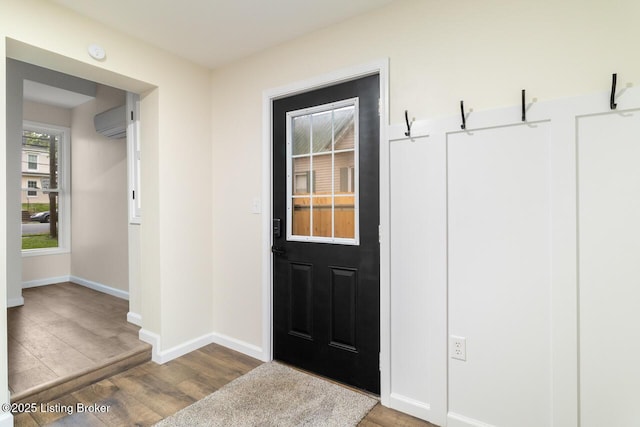 209 W High St, Lebanon, KY 40033 - interior space with a wall mounted air conditioner, wood finished floors, and baseboards