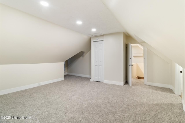 209 W High St, Lebanon, KY 40033 - additional living space featuring visible vents, baseboards, light colored carpet, vaulted ceiling, and recessed lighting