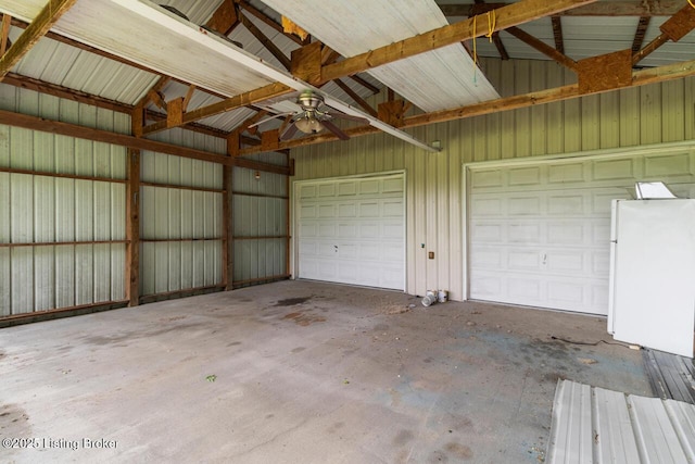 209 W High St, Lebanon, KY 40033 - garage with freestanding refrigerator, metal wall, and ceiling fan