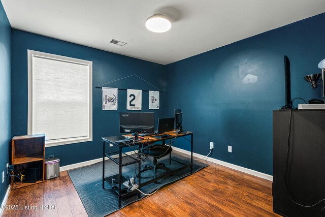 office area with wood finished floors and baseboards