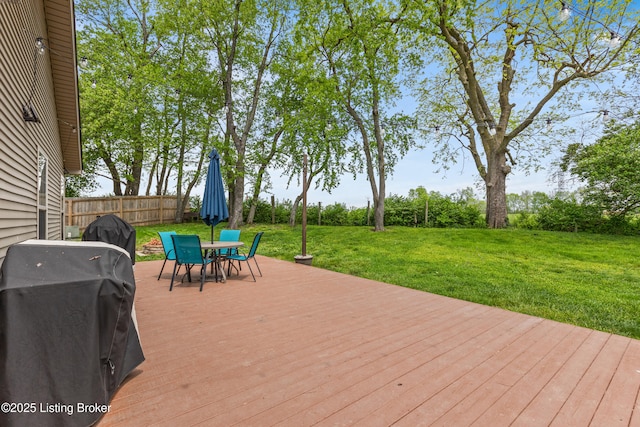 deck featuring grilling area and outdoor dining area
