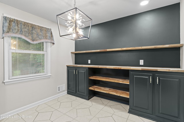 120 Emily Dr, Mt Washington, KY 40047 - unfurnished dining area featuring a chandelier and baseboards