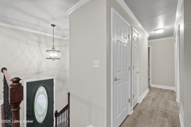 120 Emily Dr, Mt Washington, KY 40047 - hallway featuring an upstairs landing, wood finished floors, ornamental molding, and a chandelier