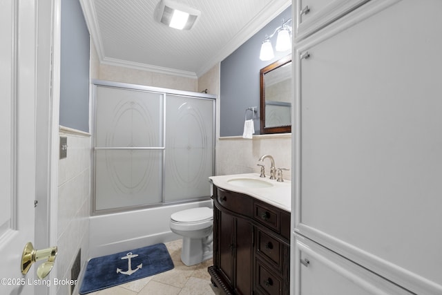 120 Emily Dr, Mt Washington, KY 40047 - bathroom featuring tile walls, vanity, shower / bath combination with glass door, ornamental molding, and wainscoting