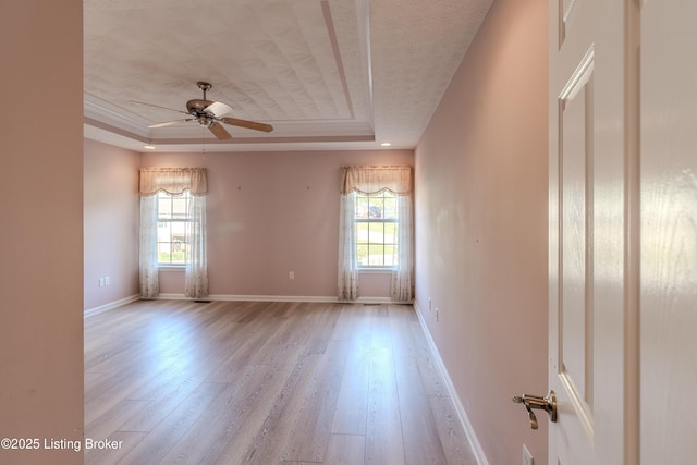 5503 Vevia Pl, Louisville, KY 40272 - unfurnished room featuring a raised ceiling, healthy amount of natural light, wood finished floors, and ceiling fan