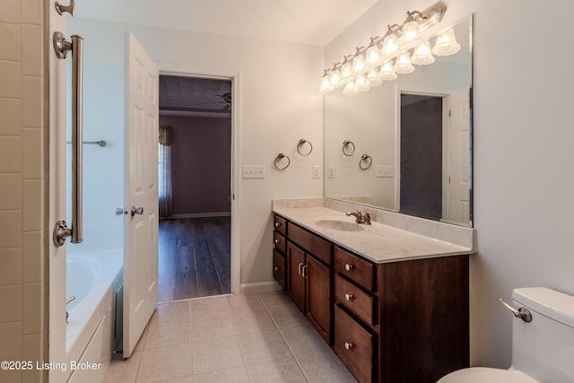 5503 Vevia Pl, Louisville, KY 40272 - bathroom with tile patterned floors, vanity, toilet, a tub, and baseboards