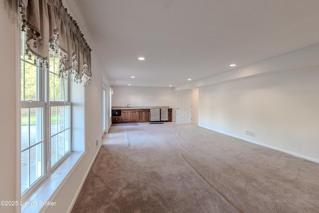 5503 Vevia Pl, Louisville, KY 40272 - unfurnished living room with carpet, baseboards, and recessed lighting