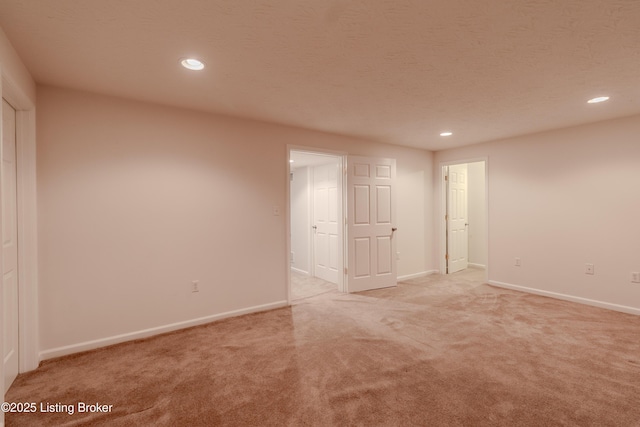5503 Vevia Pl, Louisville, KY 40272 - spare room with recessed lighting, light colored carpet, and baseboards