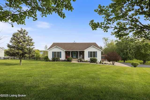 ranch-style house with a porch, fence, and a front lawn