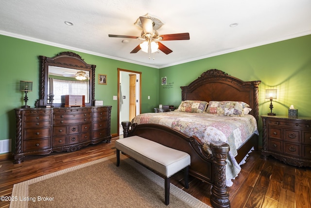 bedroom featuring crown molding, a ceiling fan, wood finished floors, and visible vents