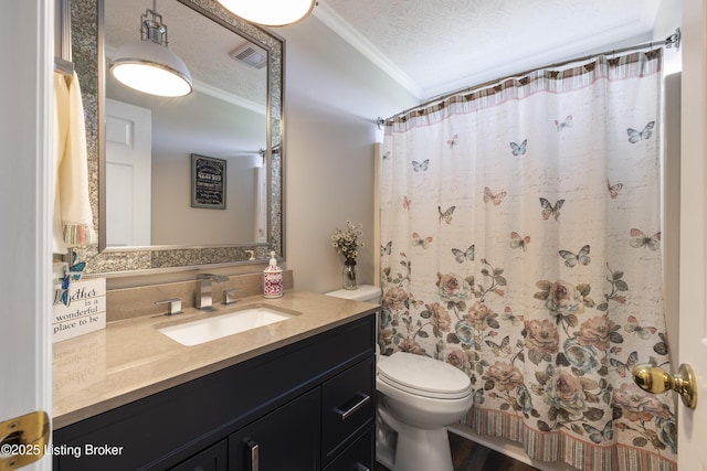 bathroom featuring visible vents, crown molding, curtained shower, vanity, and toilet