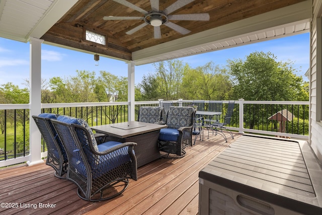 deck with ceiling fan and outdoor dining area