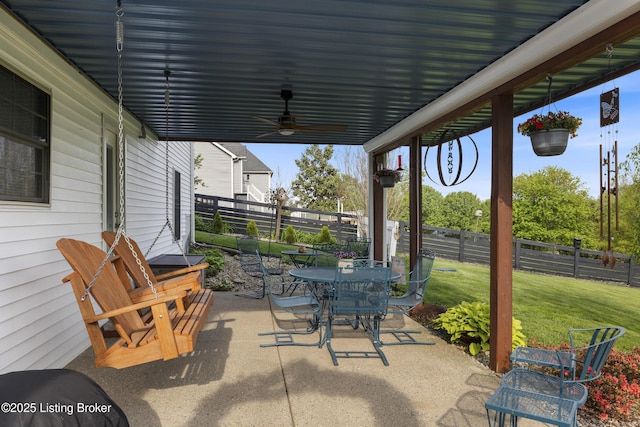 view of patio / terrace featuring ceiling fan, fence, and outdoor dining area