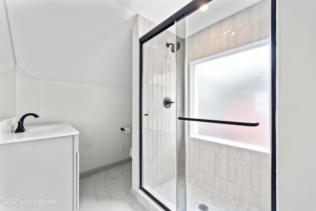 bathroom with vanity, marble finish floor, a stall shower, and toilet