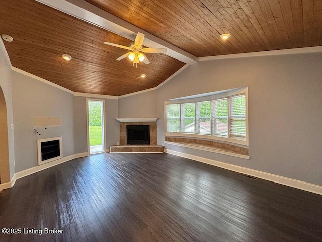 unfurnished living room with a tile fireplace, wood ceiling, healthy amount of natural light, baseboards, and dark wood-style flooring