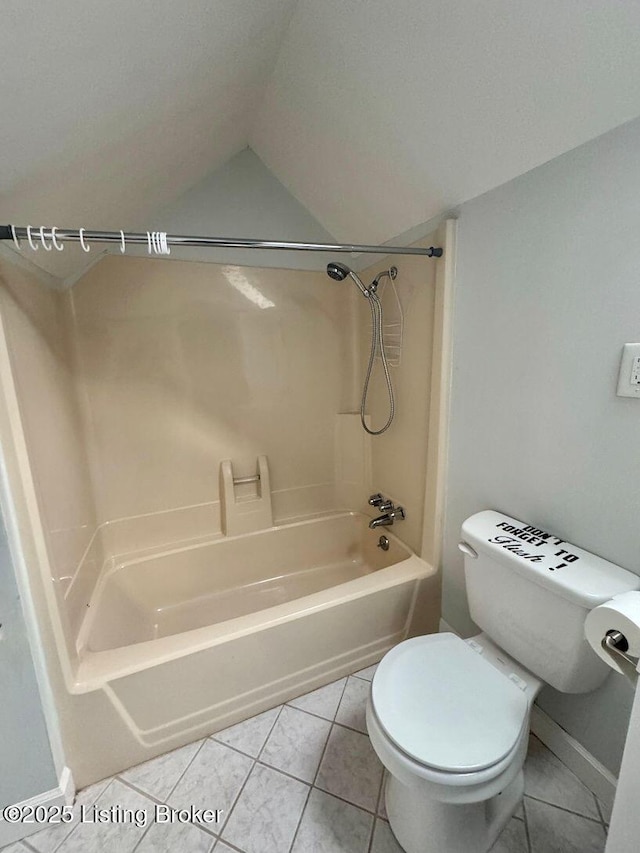bathroom featuring tile patterned floors, toilet, lofted ceiling, tub / shower combination, and baseboards