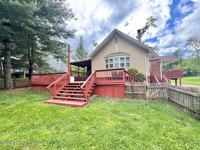 rear view of property with stairs and a wooden deck
