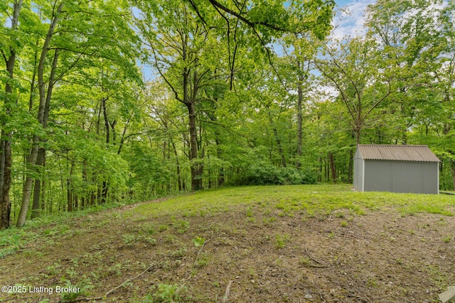 340 Cherry Pass, New Haven, KY 40051 - view of yard featuring a storage shed, an outbuilding, and a view of trees