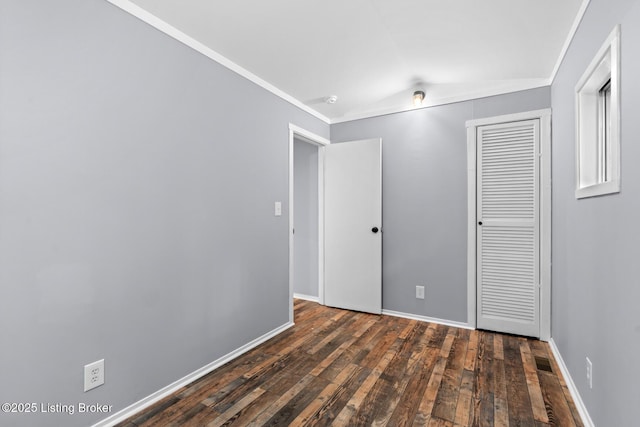 340 Cherry Pass, New Haven, KY 40051 - unfurnished bedroom with dark wood-type flooring, vaulted ceiling, a closet, baseboards, and crown molding