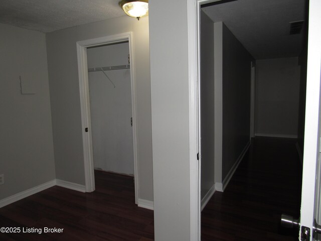 1253 Shepard Way, Shelbyville, KY 40065 - hallway featuring a textured ceiling, baseboards, visible vents, and wood finished floors