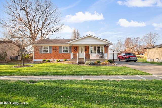 single story home featuring central AC, brick siding, a front yard, concrete driveway, and covered porch