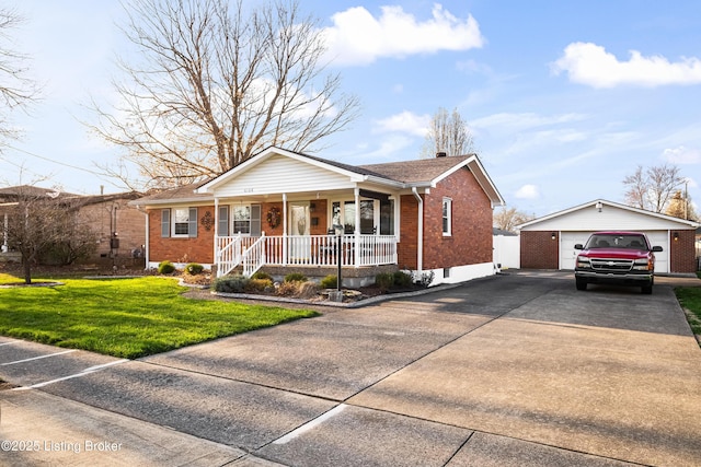 view of front of house with a front lawn, brick siding, a porch, an outbuilding, and driveway