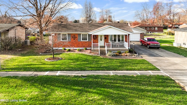 ranch-style home featuring central AC, brick siding, a garage, a porch, and a front yard