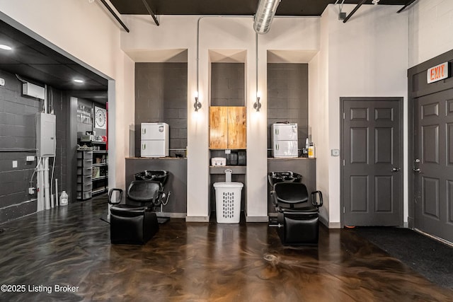 9410 Norton Comnons Blvd, Prospect, KY 40059 - entrance foyer featuring concrete block wall and concrete flooring