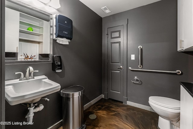 9410 Norton Comnons Blvd, Prospect, KY 40059 - half bath featuring toilet, baseboards, concrete floors, and a sink