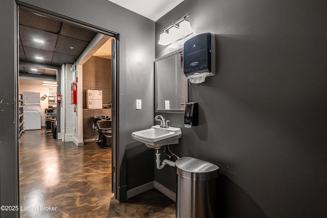 9410 Norton Comnons Blvd, Prospect, KY 40059 - bathroom featuring concrete floors, a sink, and baseboards