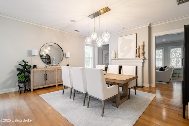 9410 Norton Comnons Blvd, Prospect, KY 40059 - dining room with light wood-style floors, crown molding, a chandelier, and baseboards
