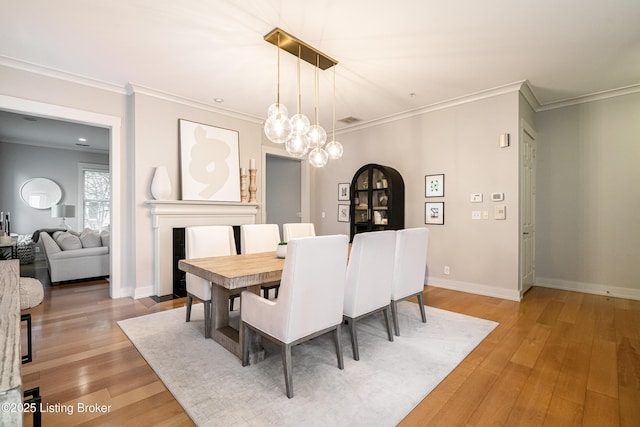 9410 Norton Comnons Blvd, Prospect, KY 40059 - dining room with ornamental molding, light wood-type flooring, and baseboards