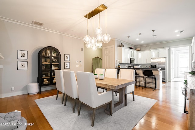9410 Norton Comnons Blvd, Prospect, KY 40059 - dining space featuring ornamental molding, light wood-type flooring, recessed lighting, baseboards, and a chandelier