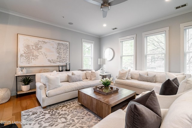 9410 Norton Comnons Blvd, Prospect, KY 40059 - living room featuring wood finished floors, crown molding, plenty of natural light, a ceiling fan, and recessed lighting