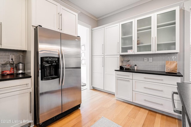 9410 Norton Comnons Blvd, Prospect, KY 40059 - kitchen with stainless steel refrigerator with ice dispenser, dark countertops, decorative backsplash, and light wood finished floors
