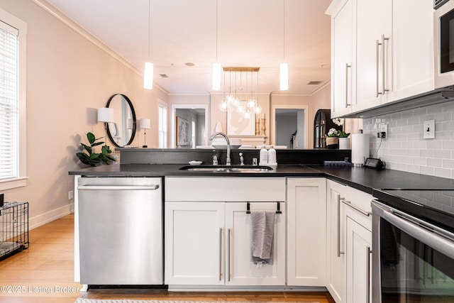 9410 Norton Comnons Blvd, Prospect, KY 40059 - kitchen featuring appliances with stainless steel finishes, a sink, ornamental molding, dark countertops, and tasteful backsplash