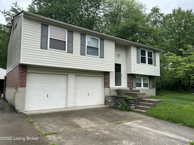 3611 Kiki Ct, Louisville, KY 40219 - split foyer home with an attached garage, concrete driveway, and brick siding