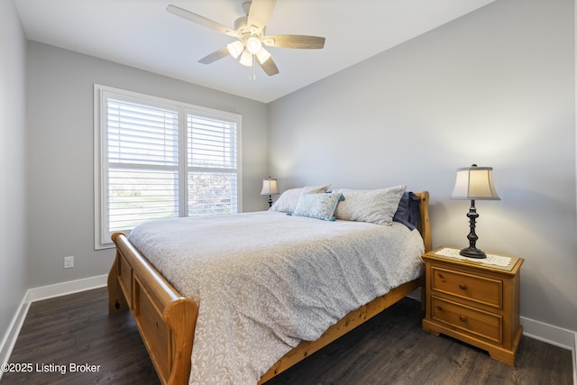 bedroom featuring baseboards, ceiling fan, and dark wood-style floors