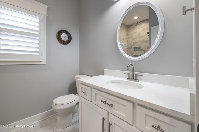 full bathroom featuring vanity, toilet, marble finish floor, and baseboards