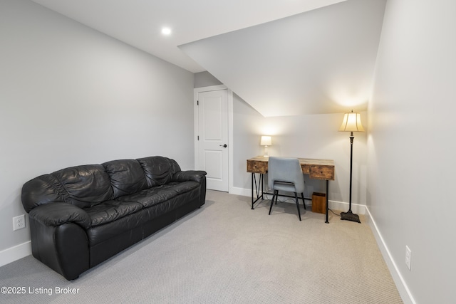 home office featuring baseboards, lofted ceiling, and carpet
