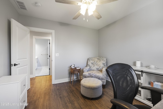 office area featuring visible vents, wood finished floors, baseboards, and ceiling fan