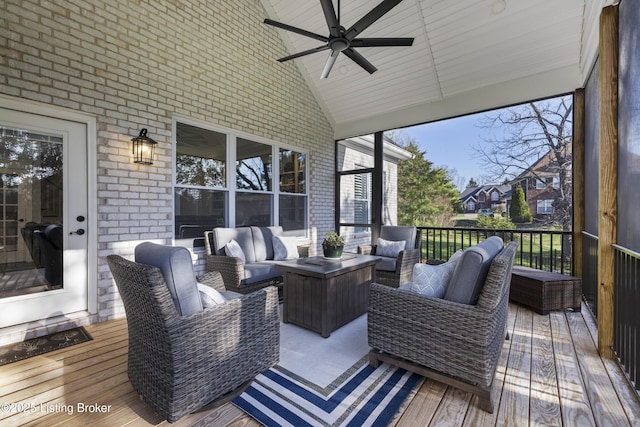 wooden terrace featuring an outdoor hangout area and a ceiling fan