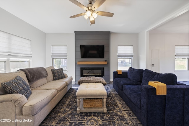9102 Pinnacle Place Dr, Louisville, KY 40272 - living room featuring ceiling fan, a fireplace, and baseboards