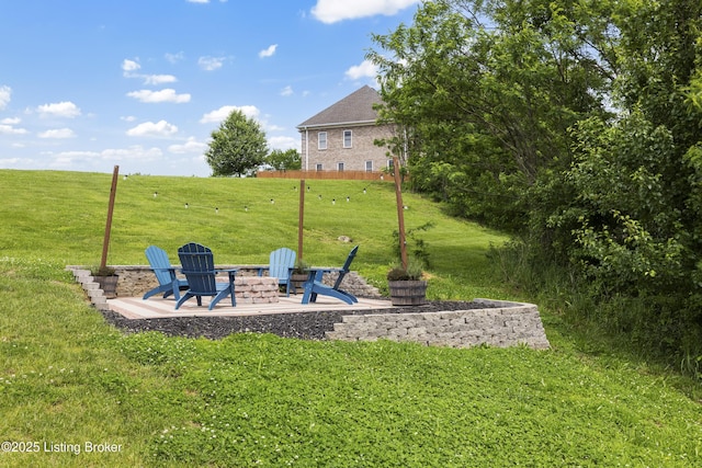 9102 Pinnacle Place Dr, Louisville, KY 40272 - view of grassy yard featuring an outdoor fire pit and a patio area
