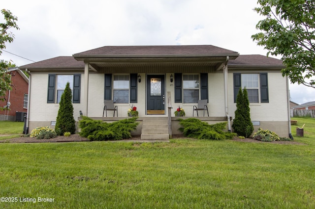 bungalow-style house with central AC unit, a front yard, a porch, and brick siding