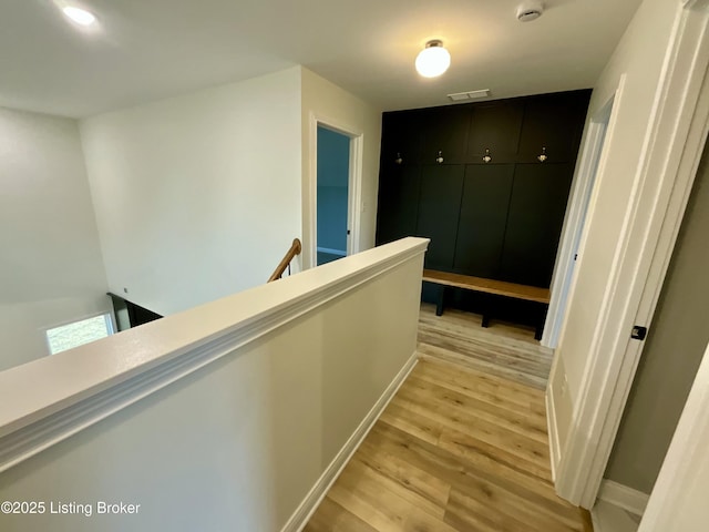 383 Webb Ln, Bedford, KY 40006 - corridor with an upstairs landing, light wood finished floors, and baseboards