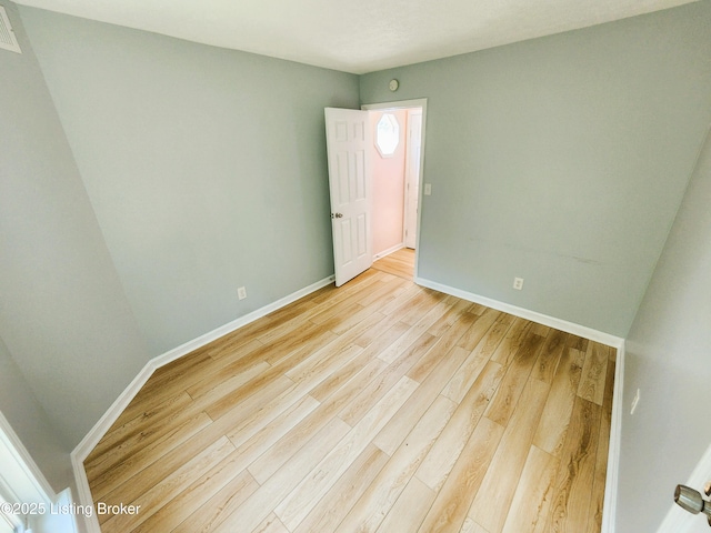 611 Malcolm Ave, Louisville, KY 40223 - unfurnished room featuring light wood finished floors and baseboards